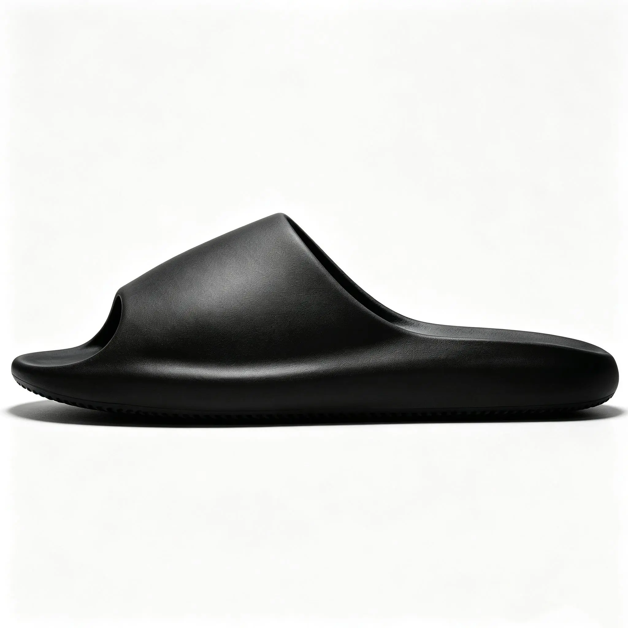 YEEZY YS-02 Slide Stealthy Black Round-toe, flat-soled slip-on slides; unisex style, versatile for everyday wear.