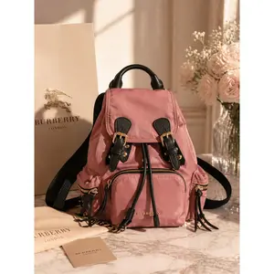 Pre-owned BURBERRY Nylon Backpacks "The Rucksack" in pink with black leather trim.