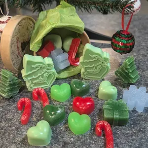 8oz comtainer full of Christmas time wax melts various scent options your a mean one