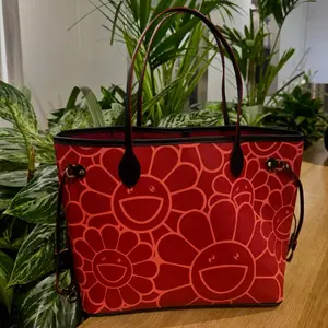Flower Never Full Tote Bag - Red Floral Design with Smiling Faces, Leather Handles, and Secure Pockets