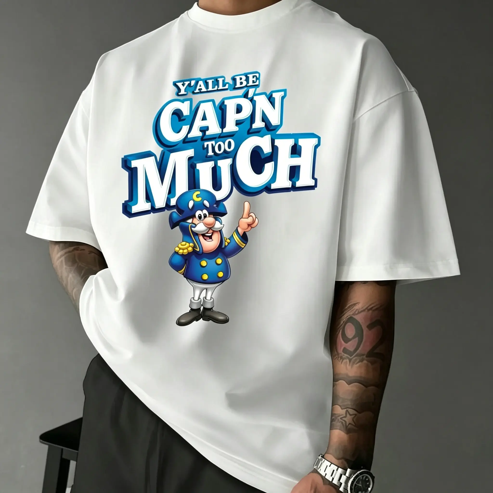 Trending "Y'all Be Cap'n Too Much" Cap'n Crunch Mascot Graphic T-Shirt, Funny Play-On-Words Meme Aesthetic Oversized Streetwear Tee, Casual White Top