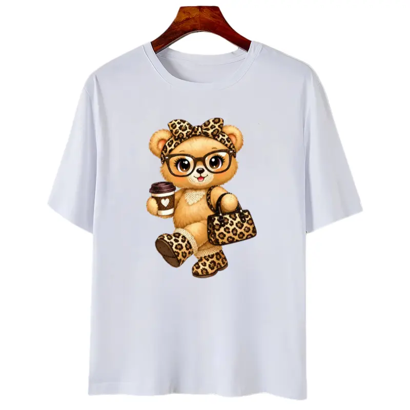 Meet your new everyday statement tee. this relaxed-fit graphic t-shirt features an adorable luxe teddy bear print with chic leopard accents for the pertect cute-meets-baddie vibe. designed with a comfy oversized silhouette that pairs ettortlessl