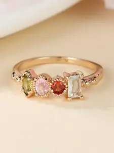 A piece of jewelry featuring a golden-colored rainbow design, Sparkling Zircon Inlay, characterized by its minimalist, elegant appearance, making it a versatile accessory suitable for everyday wear or special occasions