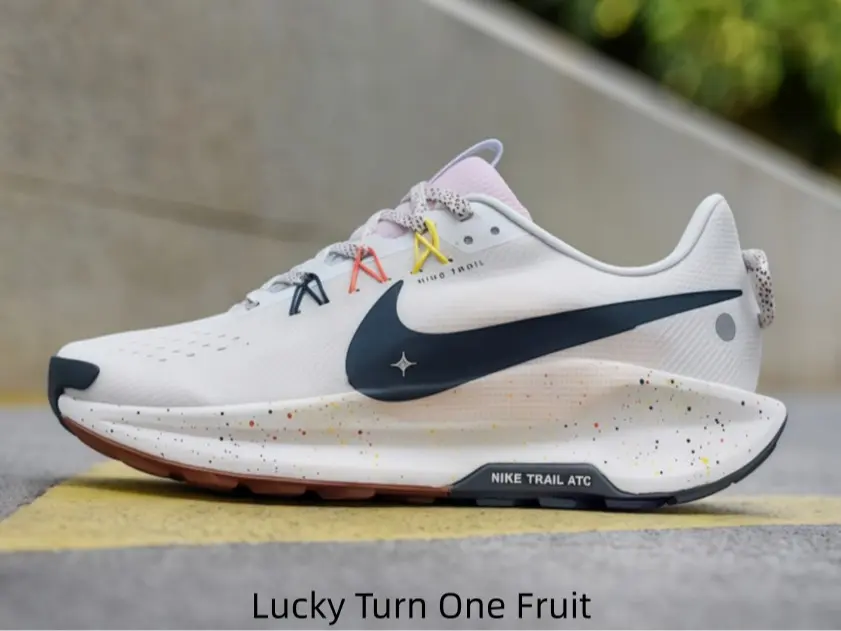 Off-white speckled athletic shoes with multicolor lace accents and warm brown outsoles deliver gentle cushioned foot support for subway rides, errand runs and casual neighborhood walks during busy weekday schedules