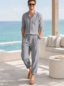 Summer lightweight, loose-fitting men's linen two-piece set comprising a long-sleeved shirt and trousers
