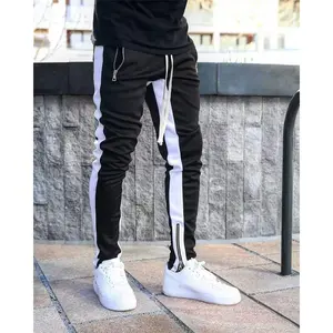 Men’s streetwear joggers with contrast side stripes and a print design, drawstring waist, casual fit, slightly stretchy fabric, suitable for spring and autumn