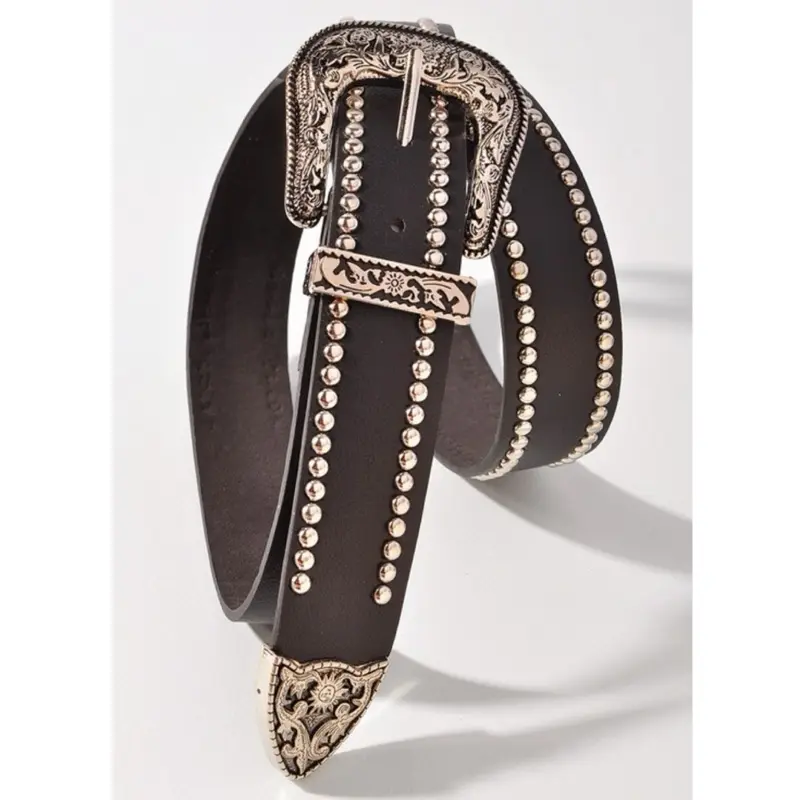 Anahi Belt -The Western Style Embellished Belt is a statement accessory crafted with intricate detailing and classic Western influences. Featuring studded embellishments along the strap and a beautifully engraved antique silver-tone buckle, this belt is b