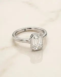 The Duran Bezel Solitaire Engagement Ring Setting for Emerald Cut Diamonds in Platinum