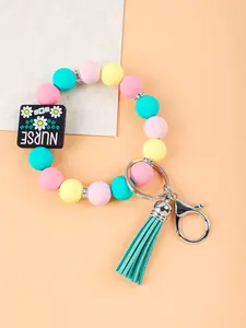 1PC Color-Blocked Silicone Bracelet Keychain, Daisy Wristband Keychain, Tassel Bead Pendant, Nurse Logo Bag Charm, Handmade Beaded Wrist Accessory, Elegant And Cute Car Keychain—Perfect For Women And Girls During Daily Commutes.