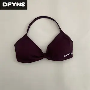 DFYNE seamless halter neck sports bra paired with high-waisted tummy-control leggings, perfect for the gym and yoga.