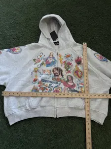 Retro gray street style hoodie featuring prominent Jesus and heart tattoo graphics and the slogan “God of Justice watches over us.” Loose, casual fit suitable for both men and women. #Y2K hoodie #religious streetwear