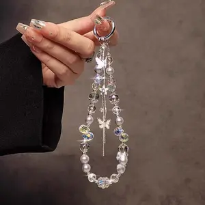 An elegant and luxurious bracelet, adorned with butterfly-shaped crystals and beads, comes with a short strap that can be attached to phone cases, car keys, and bags.