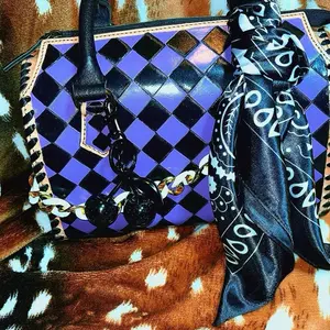 Purple and black checkered medium speedy dressed