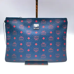 Pre-owned MCM Canvas Shoulder Bags Medium Blue Coated Clutch with Studded Print