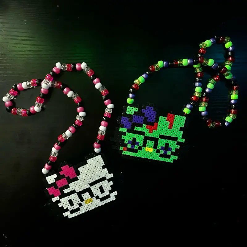 white nerd kitty girl and zombie scene kandi necklace