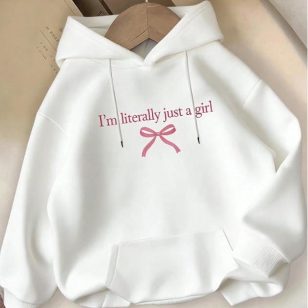 Women's casual hoodie with "I'Literally Just A" print and pink bow detail - comfortable black pullover with pockets, perfect for everyday fall and winter wear | Playful and stylish hoodie | Soft texture hoodie, women's hoodie