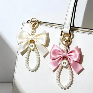 Women's Elegant Bowknot Design Bag Charm with Pearl Accents Cute Trendy Bag Keychain Fashionable Bag Decoration for Daily Use and Car Key Decor