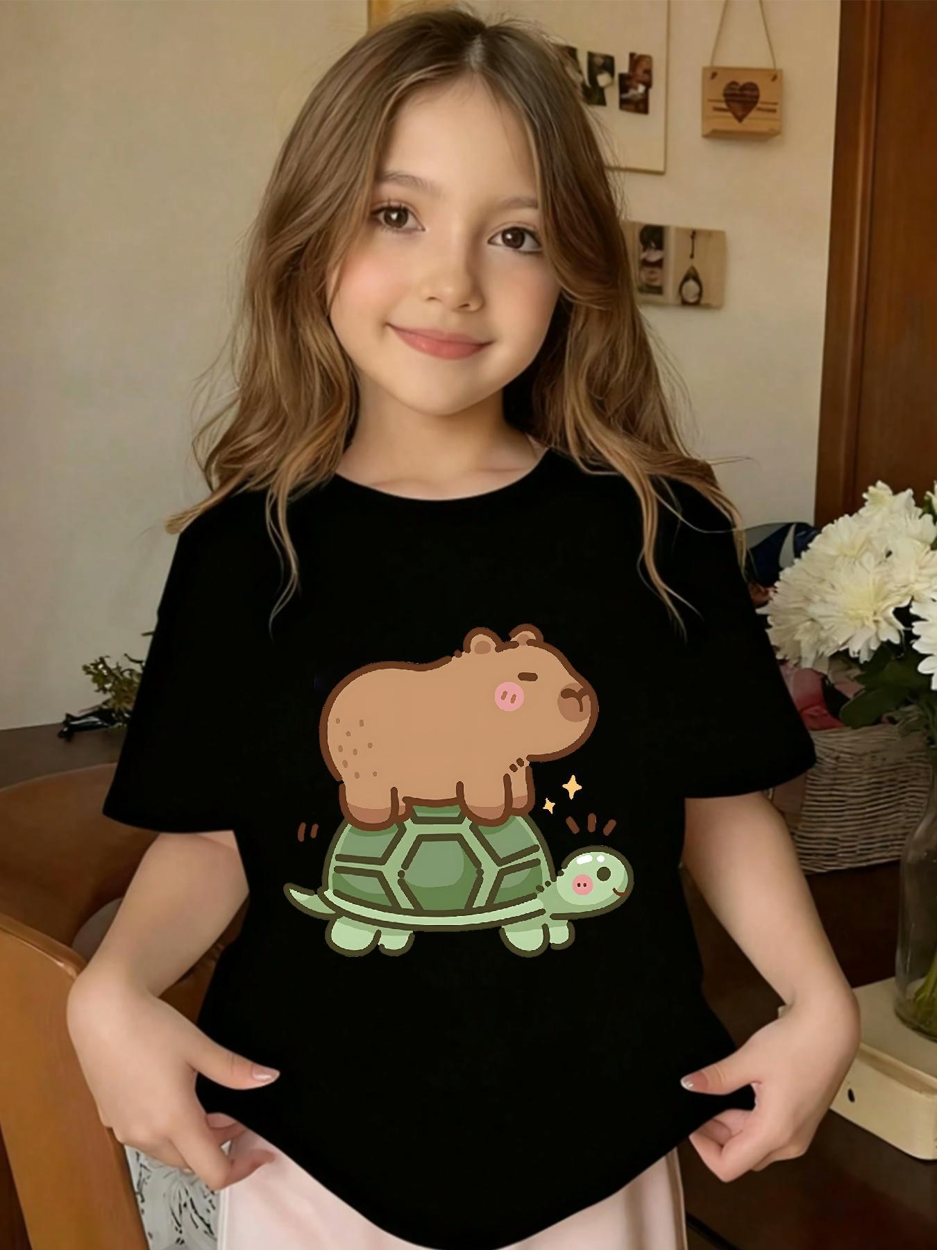 1Girls' T-shirt with Funny Cartoon of Kapi Riding a Turtle |   Casual Knit Top, Crew Neck, Regular Fit, Medium Stretch Fabric, Perfect Gift for Little Ones, All-Season Wear