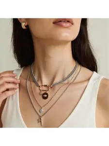 Women's gold stackable necklaces, available in various thicknesses, featuring a cross, carabiner, and a protective eye pendant. A stylish bohemian vintage-inspired jewelry set, perfect for gifting.