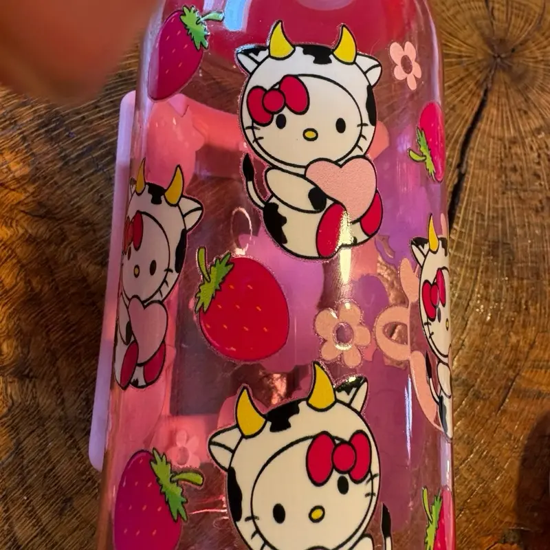 Hello kitty cow print costume with strawberry