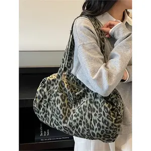 Large capacity denim leopard print luggage bag, made of tough fabric suitable for urban life, with non glaring prints, niche design, versatile tote bag, convenient sports bag, Denim shoulder satchel