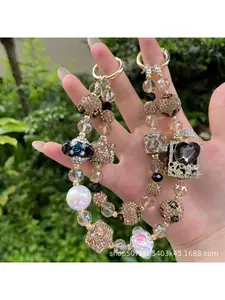 Luxurious and high-end sparkling diamond perfume bottle phone chain, hand-held lanyard, wrist strap, chain to prevent loss, stylish and trendy