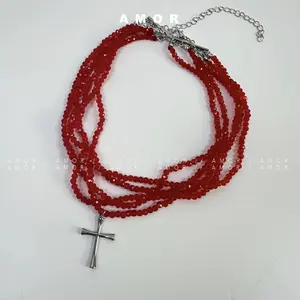 Elevate Your Style with a Layered Red Crystal Necklace Featuring a Cross Pendant