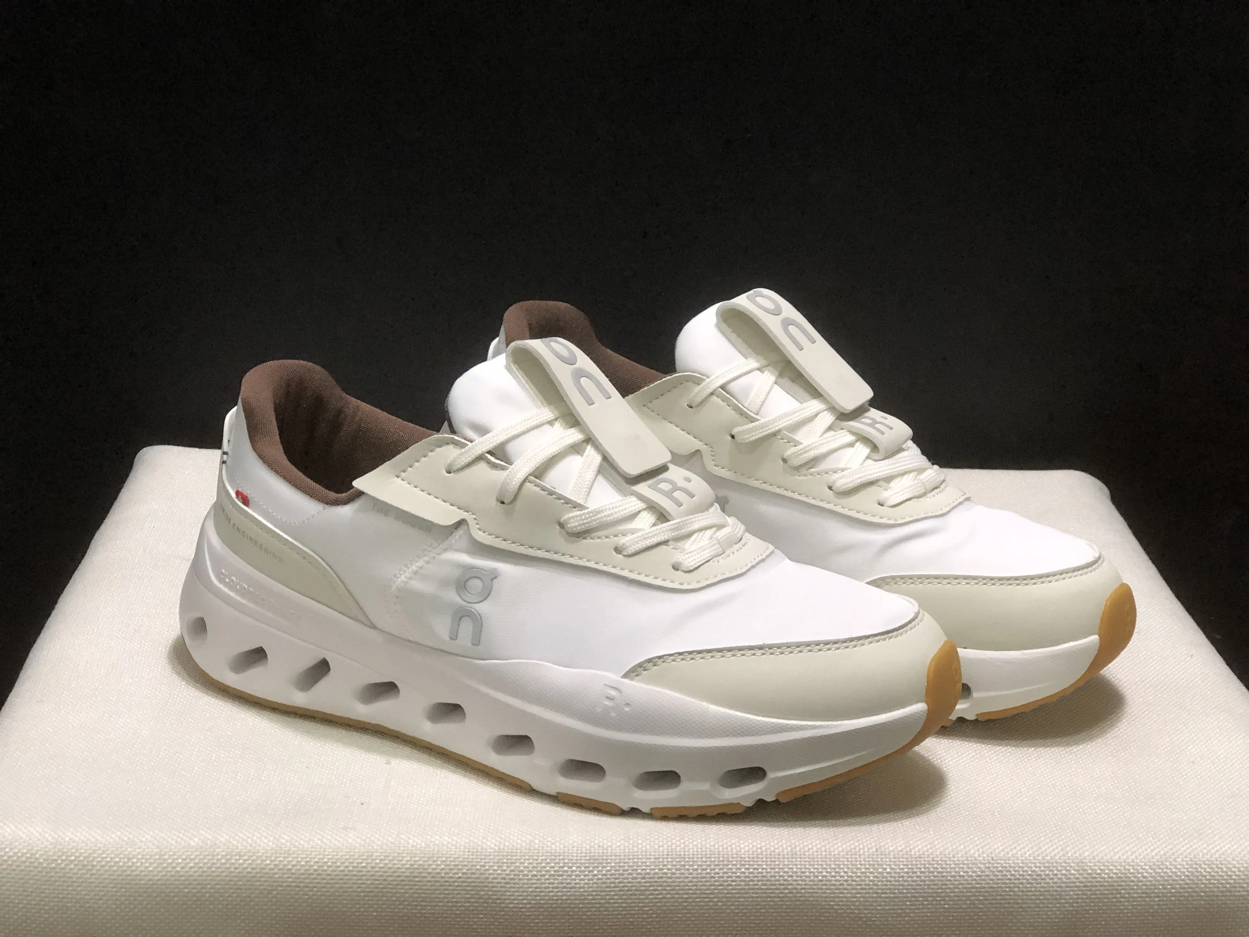Layered impact-resistant jogging performance kicks sculpted hollow cut shock buffer midsole stabilizing brown heel collar lightweight windproof fabric for outdoor marathon hill climbing sessions