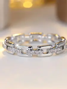 A feminine geometric design ring made of synthetic white crystal, stylish and minimalist silver in design. Suitable for use at weddings, special occasions, or as a daily wear piece of jewelry.