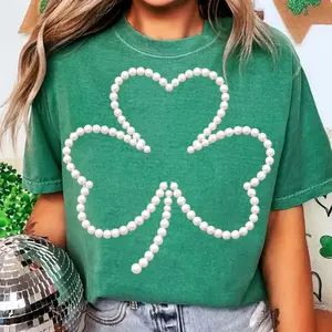 Pearl-embellished shamrock t-shirt, heat-transfer printed shamrock for St. Patrick's Day, lucky shamrock design t-shirt with pearl embellishments, elegant St. Patrick's Day design.