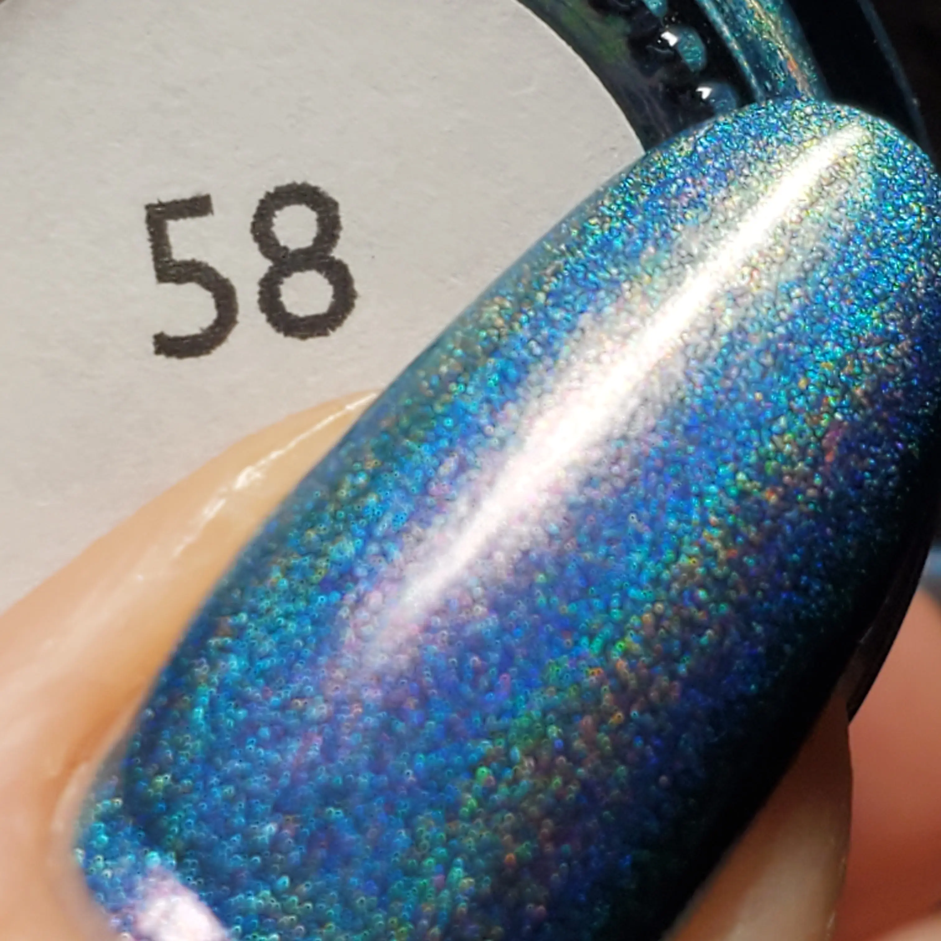 58 | A Blue Linear Holo Polish With an Aurora Shimmer That Shifts From Red to Green