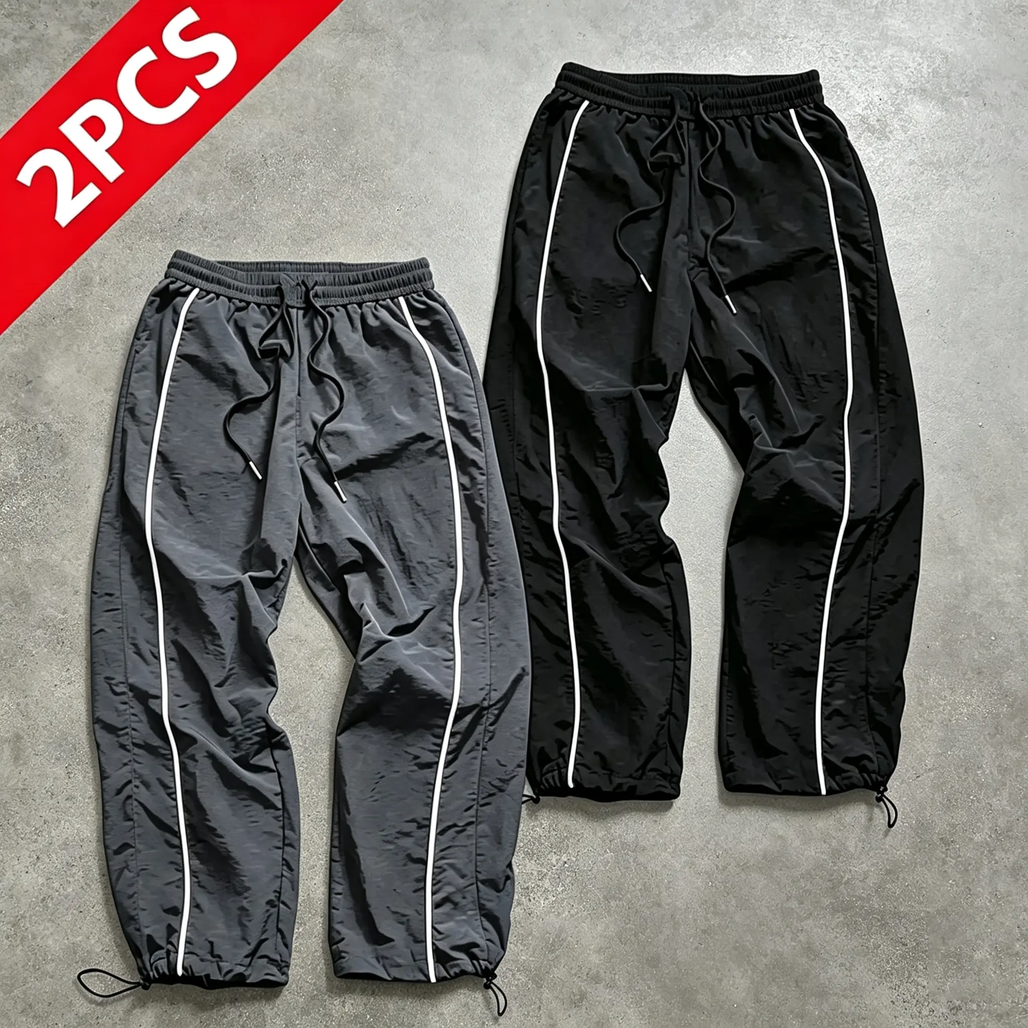 Two pairs of men’s athletic pants with white side stripes and drawstring cuffs, loose quick-dry casual long pants, elastic waistband, versatile outdoor jogging pants, available in black/gray, trendy straight-leg pants, slimming everyday long pant set
