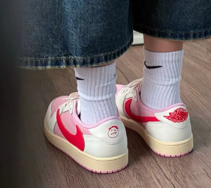 Smooth leather vintage performance sneakers built for versatile feminine street style, matte off-white with tender pink & vivid red layered color blocks, perforated toe panels, slip-resistant textured gum rubber outsole with reliable ground traction