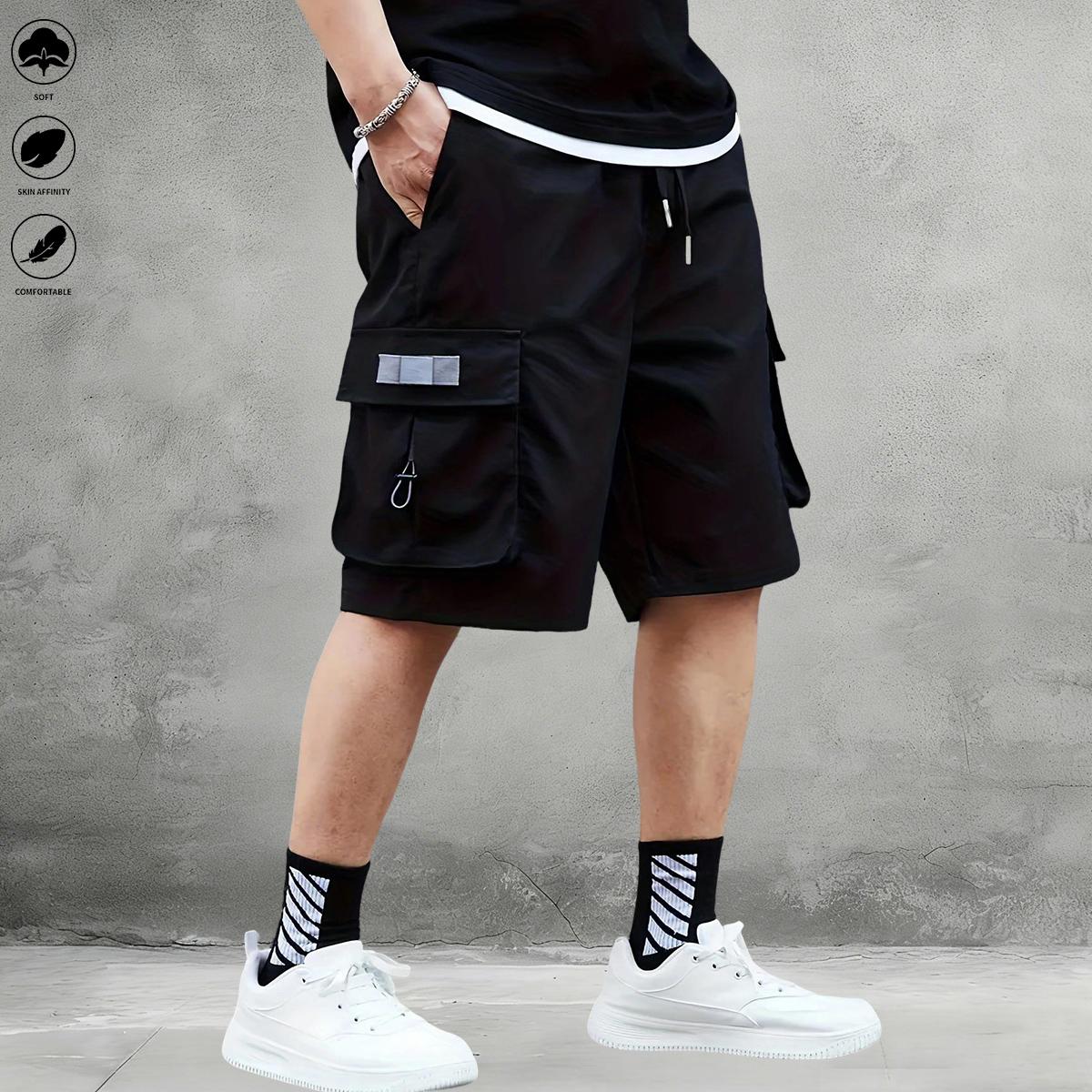 New summer men’s tactical cargo shorts with multiple pockets, made from breathable, quick-dry fabric with slight stretch; suitable for casual outings and travel; elastic drawstring waist for relaxed wear.