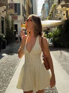 ARTYOTI Summer Casual Cute Backless Sleeveless A-Line Short Dress, Loose And Flowy Skirt. The Backless Area Has A Knotted Design, Lightweight Sheer Fabric With Soft Texture
