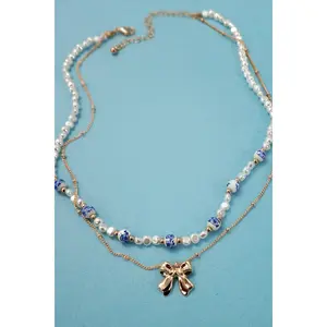 CERAMIC PORCELAIN PEARL BOW LAYER NECKLACE |