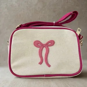 Crossbody Bag with Pink Fabric Bow - Simple Design Handbag Featuring a Pink Accent Bow Decoration