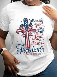 Women'S Crew Neck T-Shirt for Independence Day Showcasing a Patriotic Cross And a Bible Verse That States 'Where The Spirit of The Lord Is There Is Freedom' from 2 Corinthians 3:17. It Features Colors of The Flag And Stars