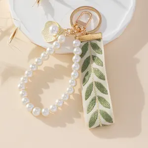 Elegant Leaf Ribbon Pearl Wristlet Keychain - Fashionable Phone Lanyard and Car Key Ring Accessory with Handmade Beaded Design, and Versatile Use