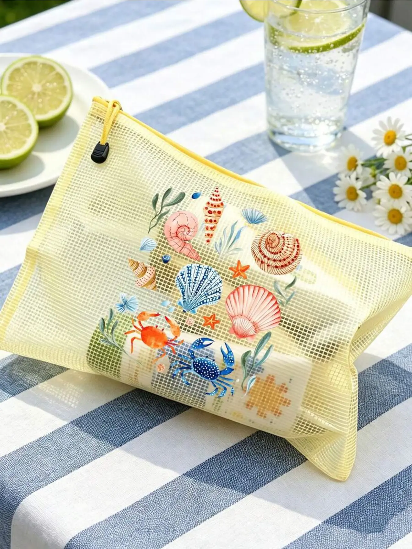 Multicolor mesh beach bag with ocean shell printed makeup pouch. Lightweight, durable and spacious, ideal for storing sunscreen, swimwear and beach essentials. Perfect for spring and summer swimming use. Cosmetic Pouch