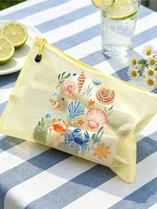Multicolor mesh beach bag with ocean shell printed makeup pouch. Lightweight, durable and spacious, ideal for storing sunscreen, swimwear and beach essentials. Perfect for spring and summer swimming use.