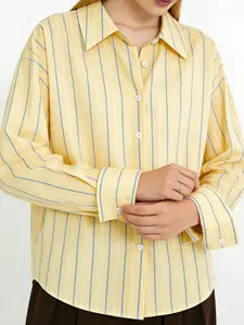 A women's fashionable yellow and blue striped loose long sleeved shirt, with a refreshing stripe design and a loose fit that covers the skin. It is suitable for commuting to work, shopping and outdoor activities, indoor and outdoor dressing