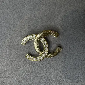 Pre-owned Vintage Chanel Gold Metal Rhinestone Designer Logo Brooch