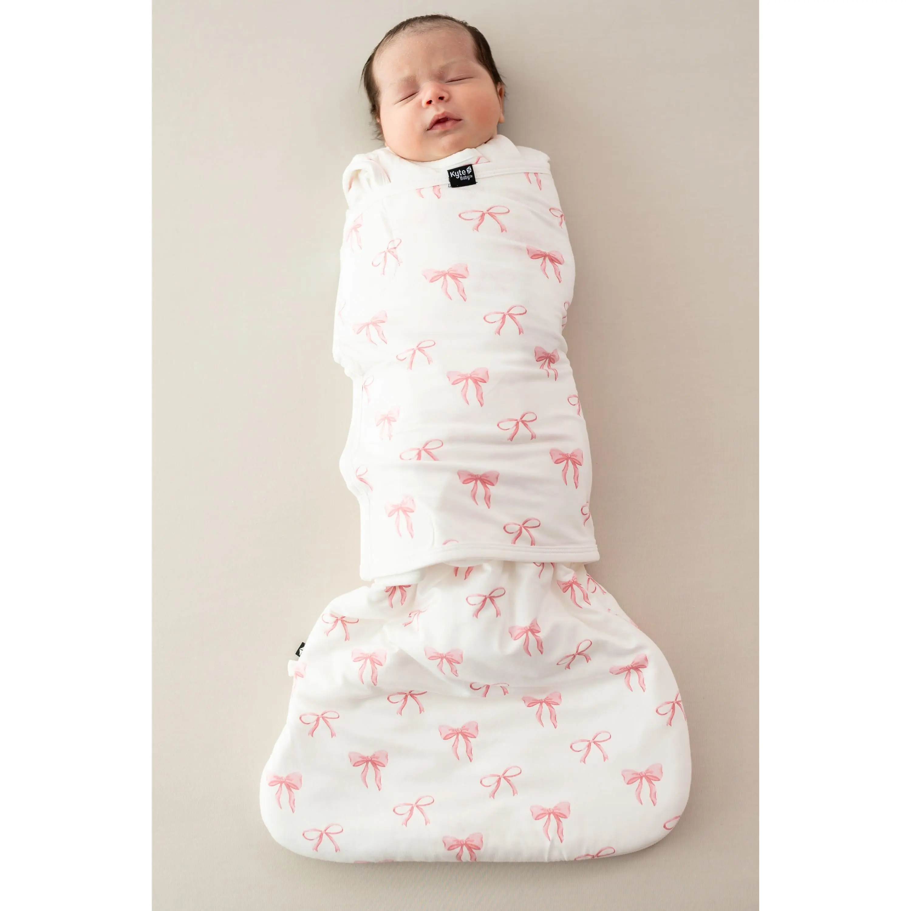 Kyte Baby Newborn Adjustable Swaddling Wrap Sleep Bag Swaddler with Bow 1.0, Luxurious Fabric, Velcro Closure
