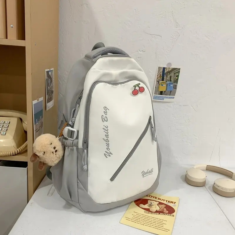 Minimalist Color-Block Nylon Backpack with Cherry Pin & Plush Pendant - Lightweight Travel Daypack for Daily Commute