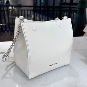 Milk Box cowhide leather women’s handbag with an original design