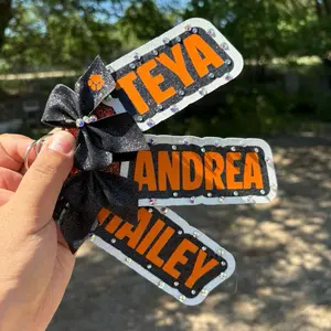 Stitch and Beam+ Custom Bag Tag Sports Tag Cheer Tag Personalized with Orange Text and Black Bow Design