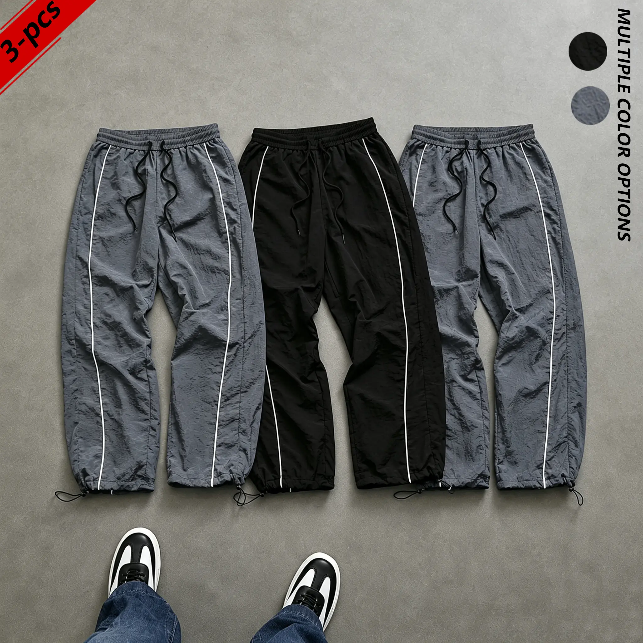 3-pack men’s casual pants—lightweight, breathable, comfortable parachute pants featuring side stripes and an elastic waistband with drawstring; American retro street casual athletic pants suitable for everyday wear.