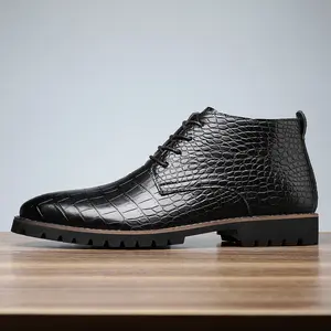 A pair of men's casual boots - solid color stirrup design, faux leather upper, rubber sole, faux lining and insole, versatile everyday shoe for all seasons