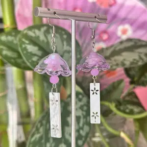 Purple Furin Wind Chime Japanese Earrings with Pink Bell Design and White Floral Accents